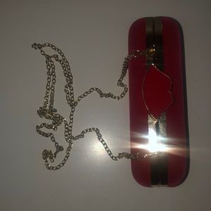 Red velvet clutch with 👄 detail